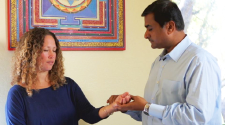 Dr. Suhas Kshirsagar checks the pulse of a patient.